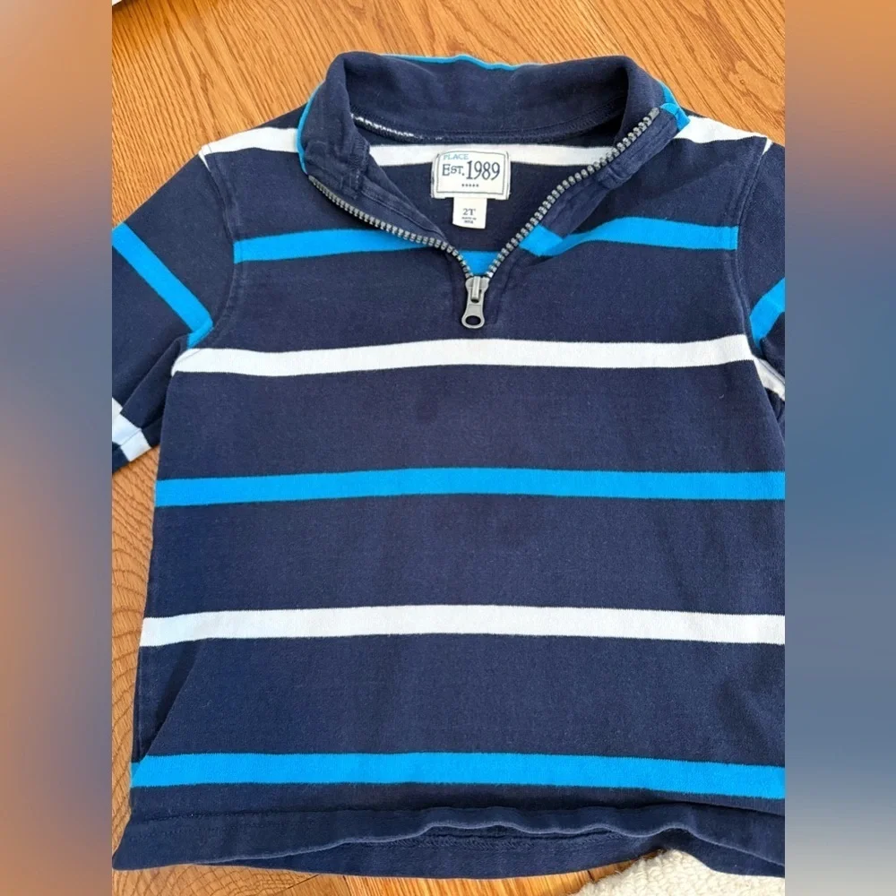 The Children's Place quarter-zip pullover in navy, white, and light blue stripes